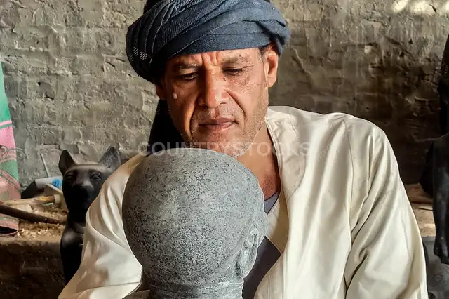 Egyptian Artisan Sculpting Stone Statue, Luxor Workshop