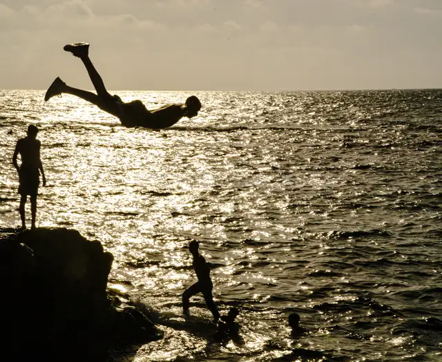 Youth Cliff Jumping into Sea, Alexandria