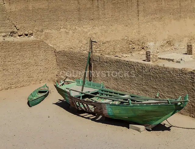 Traditional Wooden Boats, Ancient Mud-Brick Citadel Wall