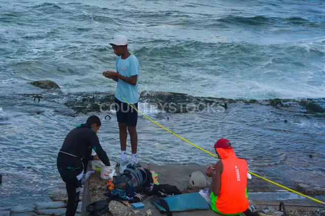 Young Men Shore Fishing on Rocky Alexandria Coast