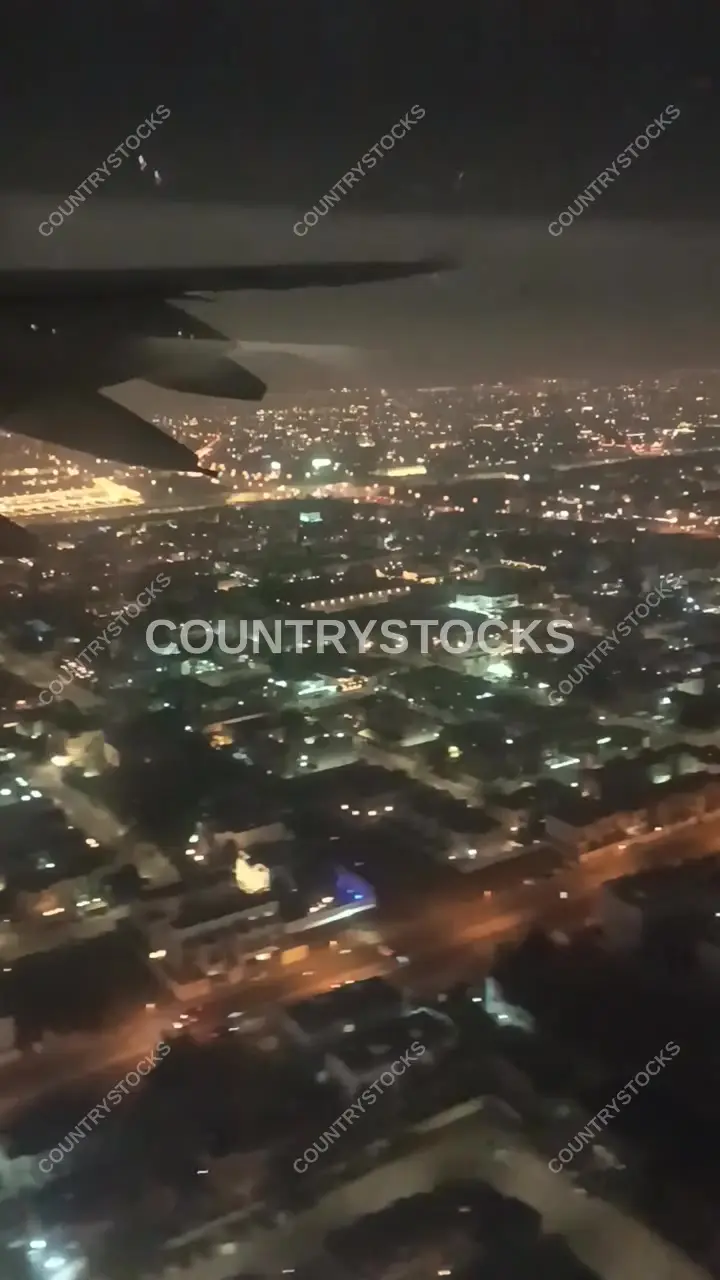 Dubai City Aerial Night View from Aircraft Window