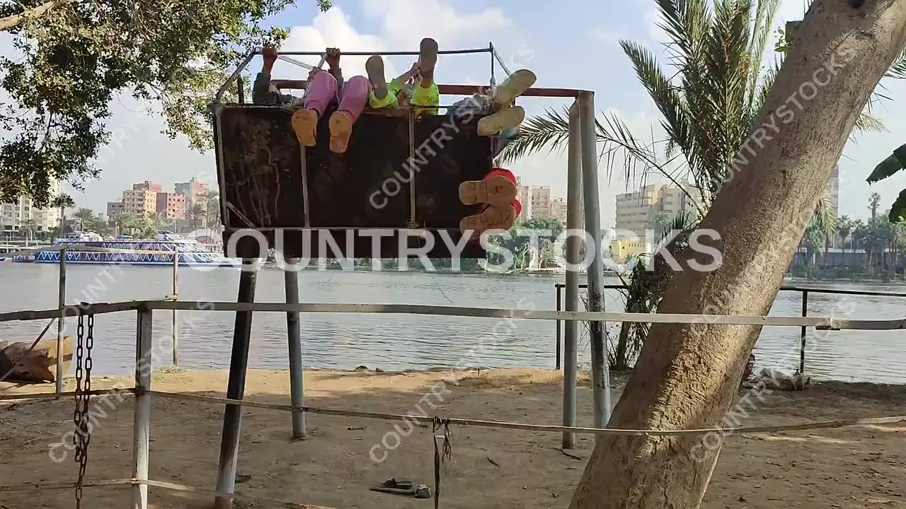 Children Playing on Swing, Dahab Island Nile Giza