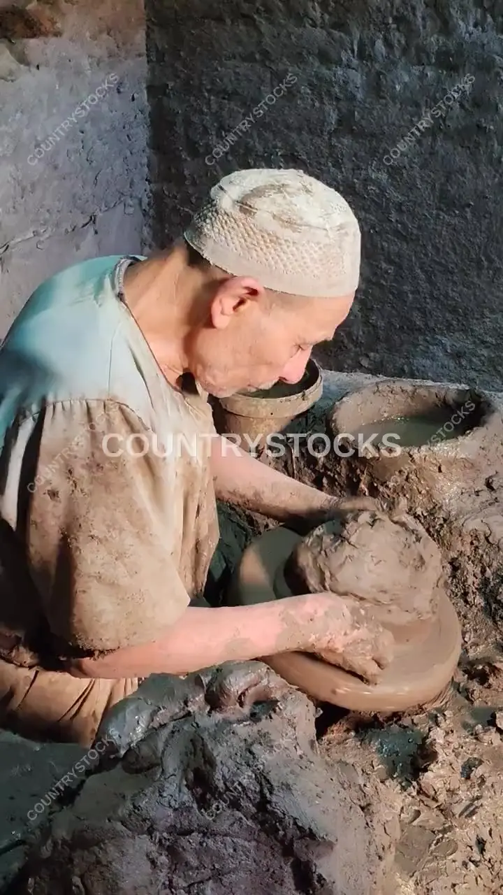 Elderly Potter Shaping Clay, Pottery Workshop Al-Monofeya
