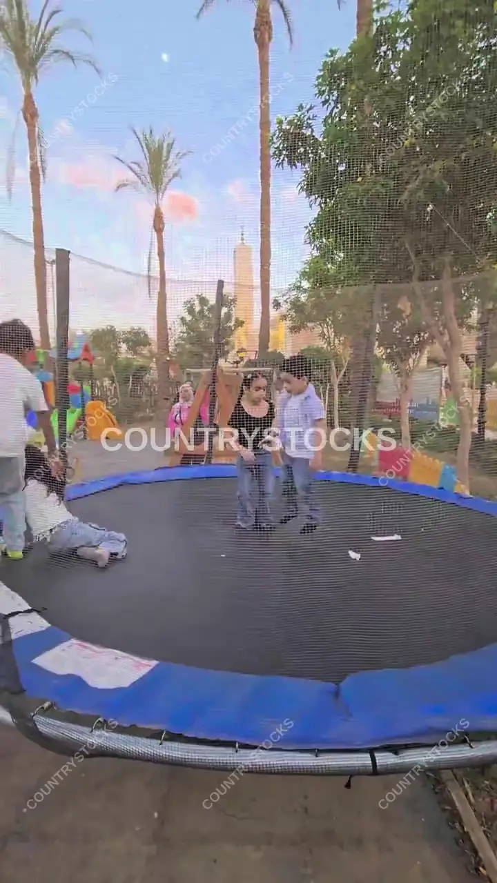Children Jumping on a Trampoline During Eid Celebration