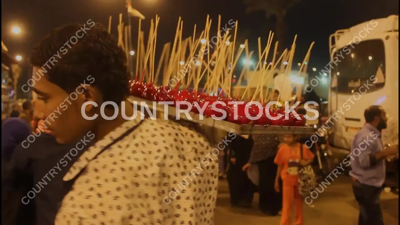 Street Vendor Selling Honey-Coated Apples on a Tray in Cairo, Egypt  – Video