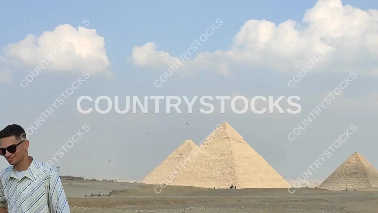 Three Giza Pyramids Wide Shot with Paramotor Flyers